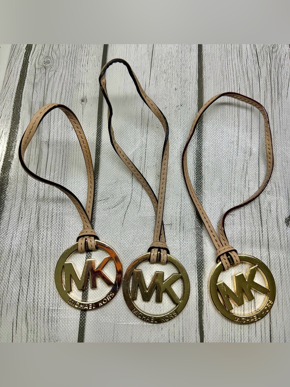 PRE LOVED Michael Kors MK Hang Tag Beige Leather Strap Gold Charm